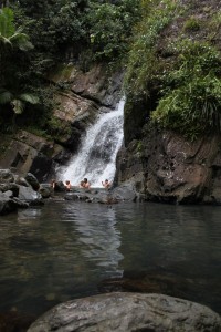 Swimming under waterfall in Puerto Rico